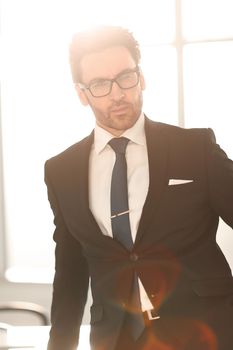 close up.serious businessman standing in the office.business people