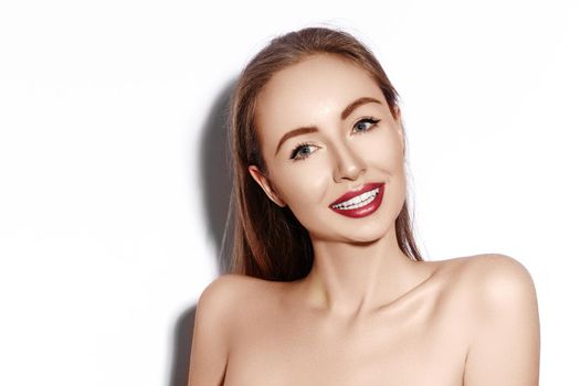 Sexy smiling woman with Glamour Red Lips, bright Makeup, clean Skin. Smile with White Teeth. Happy Fashion Girl on white background