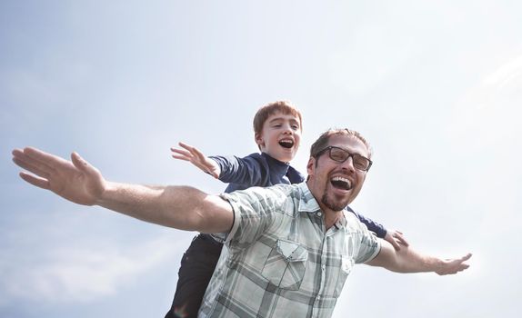 funny father and son spend time together.the concept of friendly family