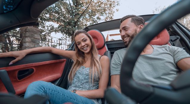 close up.loving couple enjoying a trip in the car.