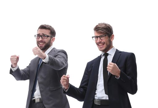 in full growth. two happy dancing young businessmen . isolated on white background.