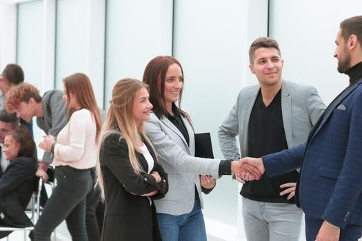 business colleagues greeting each other with a handshake. office workdays
