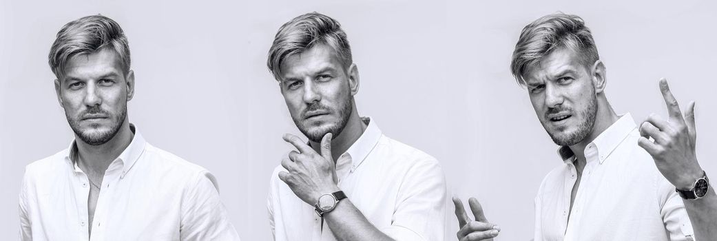 Black and white portrait of handsome smiling man isolated on white studio background posing to the camera