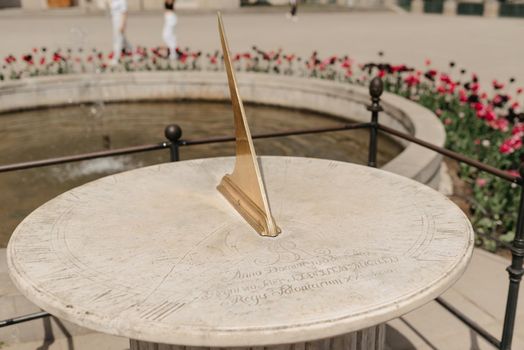 Warsaw, Poland - MAY 12, 2022: The sundial clock near the Palace on the Isle in the Royal Baths Park, Lazienki Park