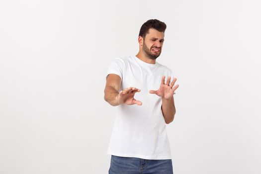 Close up portrait of disappointed stressed bearded young man in shirt over white background