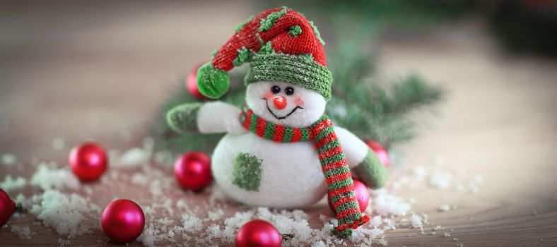 Christmas card. toy snowman on a festive background.photo with place for text