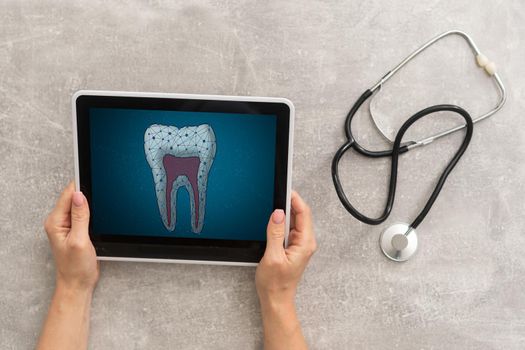 Dentist Office-Digital tablet with a patients x-rays.