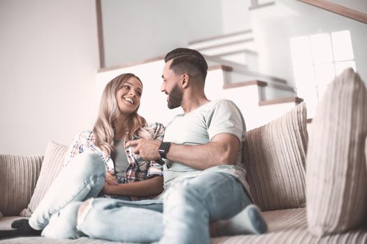 close up. loving couple sitting on sofa in cozy living room