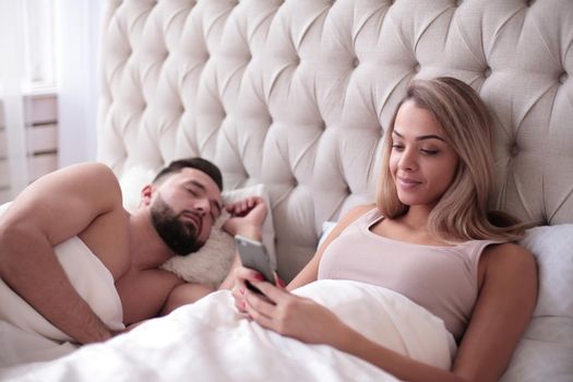 young woman reading the family correspondence in the bedroom. photo with copy space