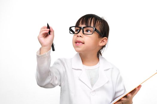 Portrait of a little scientist holding a clipboard with a pen thinking on a white background. A little girl role playing in a doctor or science costume.