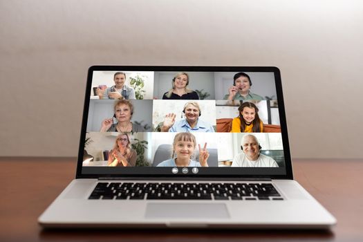 Laptop screen webcam view different ethnicity and age people engaged in group videocall. Video conference. Modern technology, easy convenient on-line meeting concept.