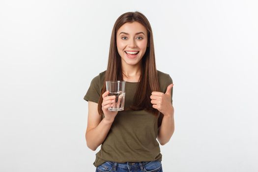 portrait of attractive caucasian smiling woman isolated on white studio shot drinking water