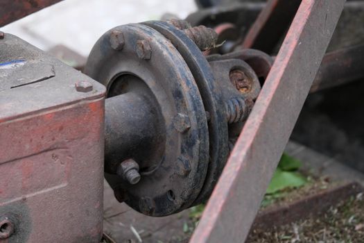 Corrosion and erosion of old truck axles.