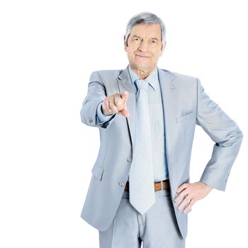 Nice businessman at the age, point the finger. Isolated on a white background.