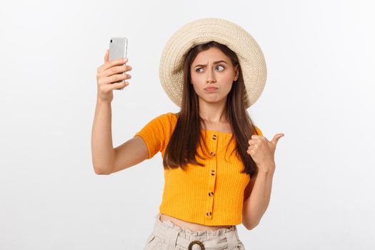 Young Caucasian woman enjoying the selfie with herself isolated on white background summer travel concept