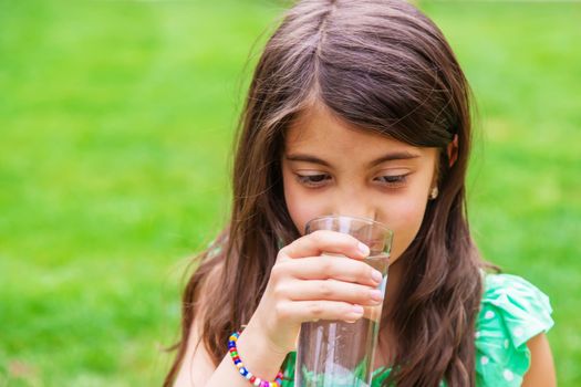 children drink clean water in nature. selective focus. nature