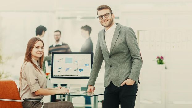 consultant in financial investments and Manager of the company in the workplace in a modern office.the photo has a empty space for your text.