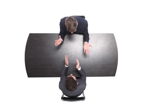 top view. two business people discussing something at a meeting . isolated on white