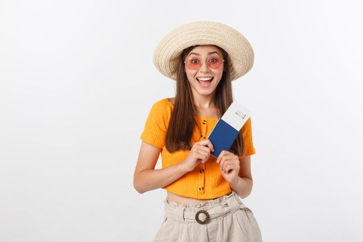 Portrait of happy tourist woman holding passport on holiday on white background