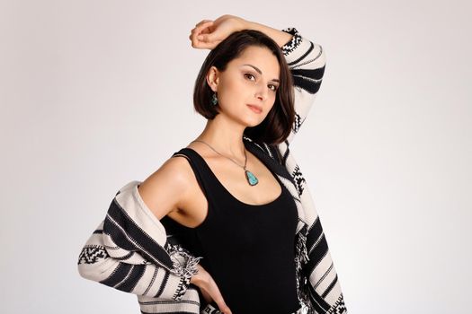 Studio portrait of young woman boho style on white background