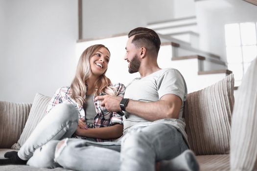 close up. loving couple sitting on sofa in cozy living room
