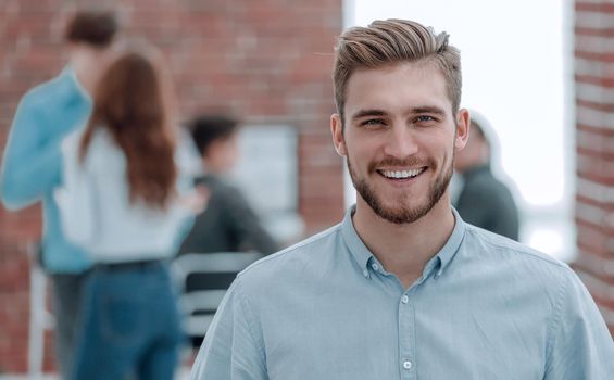 Portrait of handsome businessman in office