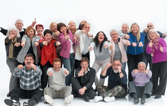 Group of happy elderly people standing and sitting isolated over a white