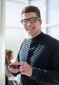 Close up of businessman using smartphone. Business concept