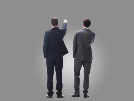 rear view. two businessmen looking at copy space. isolated on white background.