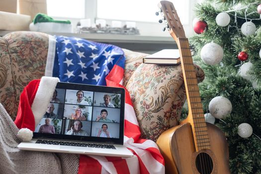 laptop with video chat at christmas and usa flag.