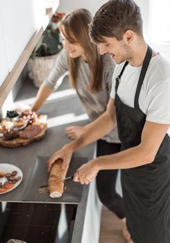 modern young couple having fun making sandwiches for Breakfast.