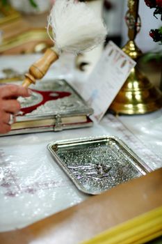 Priest consecrating ostia