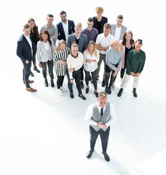 top view. young leader standing at the front of the business team . business concept