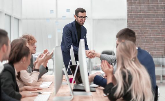 business people shaking hands at a work meeting. photo with copy space