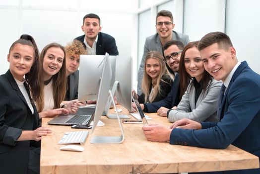 close up. team of young professionals sitting at an office Desk