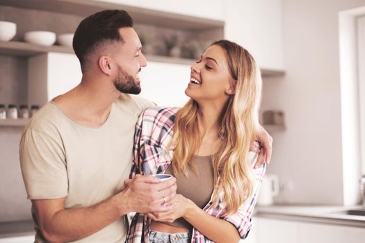 close up. happy young couple in kitchen in good morning time