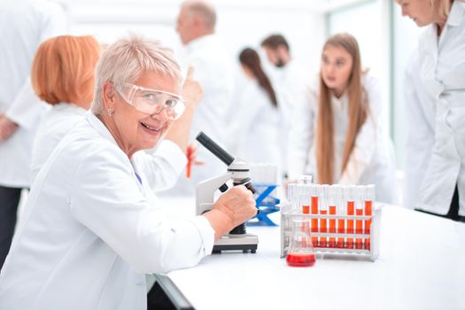 close up. female scientist sitting at a Desk in the laboratory.