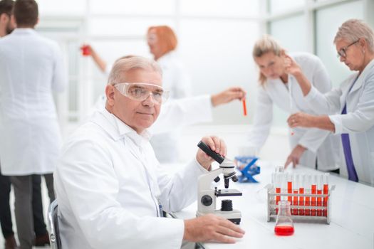 close up. smiling scientist at the workplace in the laboratory.