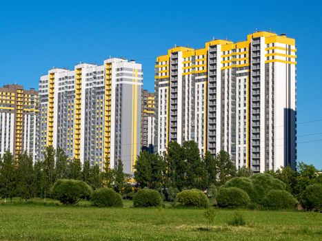 New quarters. Multi-story building on a background of blue sky.