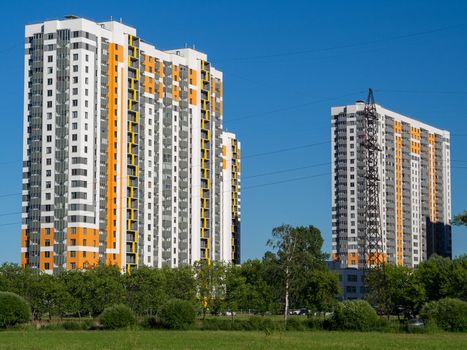 New quarters. Multi-story building on a background of blue sky.