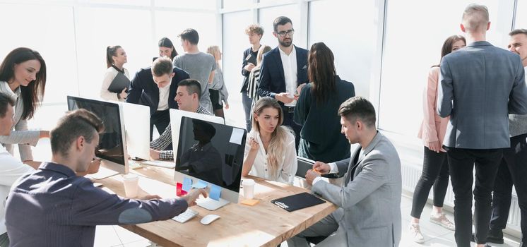 young colleagues discussing work issues at the workplace. office workdays