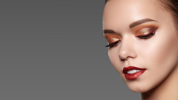 Beautiful Woman with Professional Makeup. Celebrate Style Eye Make-up, Perfect Eyebrows, Shine Skin. Bright Fashion Look.