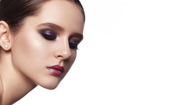 Beautiful Woman with Fashion Makeup. Celebrate Style Smoky Eye Make-up, Shine Skin. Bright Evening Look with purple Eyeshadows