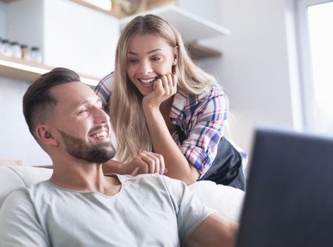 close up. young married couple looking at laptop screen