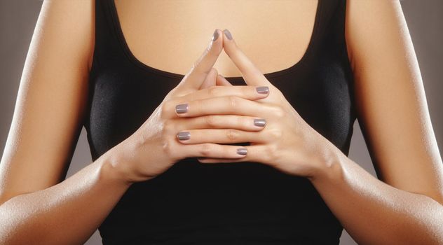 Woman hands in mudra symbol. Symbolic or ritual gesture in Hinduism and Buddhism. Self-healing and self-making practice. Relaxation in yoga