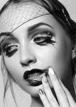 20s Dramatic Fashion Look Woman. Beautiful Model with Retro Make-up. Makeup Style for Halloween. Cinematic Black and White Portrait