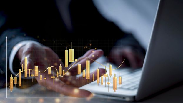 Businessman show golden stock market bar chart grow up to target. Business finance concept. Businessman's hands Show success graph, stocks grow every year 