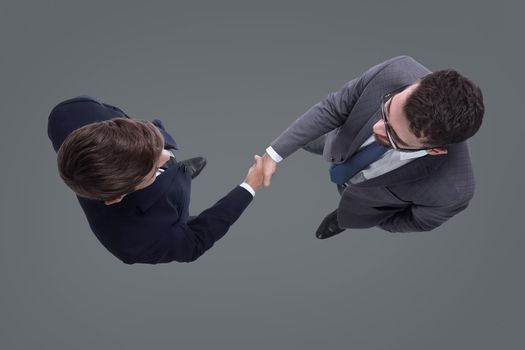 top view. business people shaking hands. isolated on white background