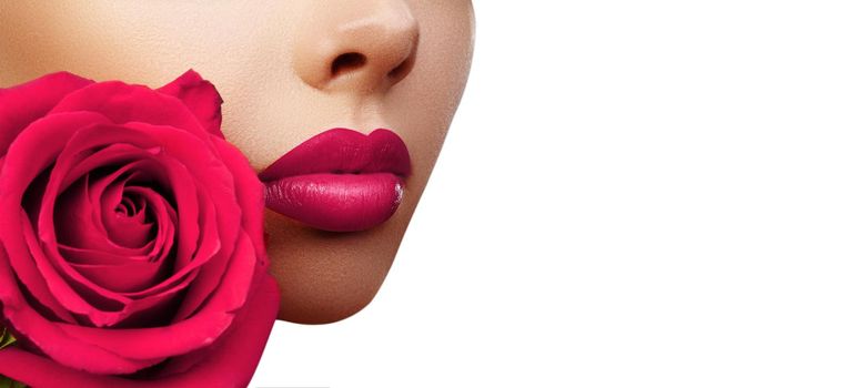 Lips with Bright Lipstick Makeup. Beautiful Macro with Tender Pink Rose Flower. Valentines Day Style with Copy Space for Text