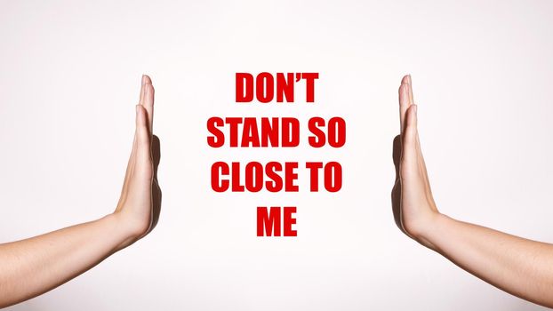 Don't Stand So Close to Me. Distancing and Contact-less Greetings. Healthcare Poster with Red Inscription. Two Hands Gesture Limit Social Distance. Public Health Concept